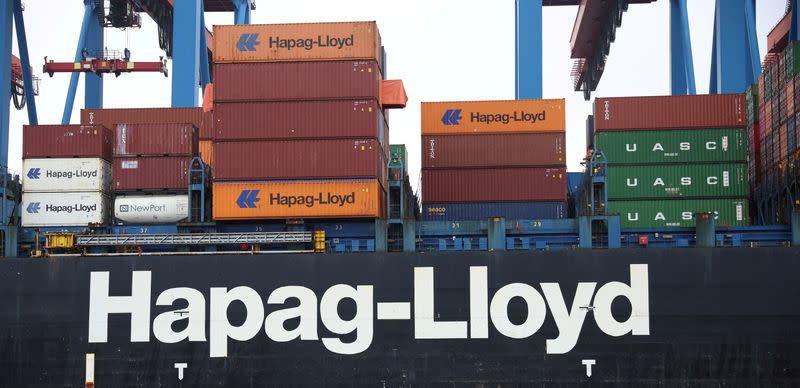 FILE PHOTO: Containers are unloaded from the Hapag-Lloyd container ship Chacabuco at the HHLA Container Terminal Altenwerder on the River Elbe in Hamburg, Germany