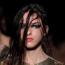 <b>Julien Macdonald</b><br><br>Models had messy, wet-look hair worn with smokey eyes and peachy lips.<br><br>Image © PA