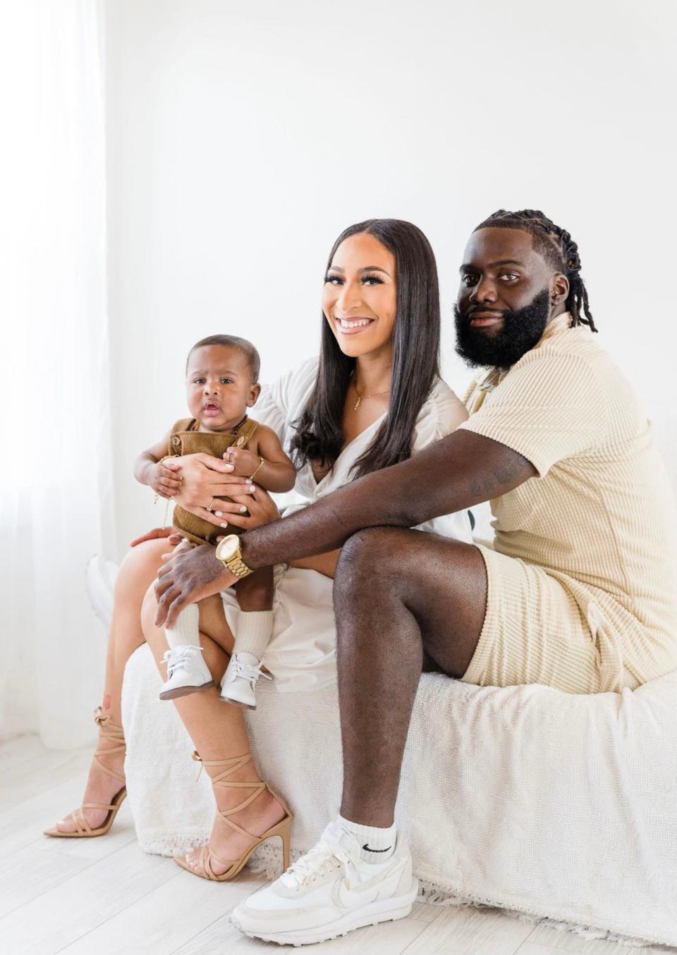 Louisiana senior linebacker Kris Moncrief poses with his five-month-old son Kannon, left, and longtime girlfriend Jazlynne Sonnier, middle.