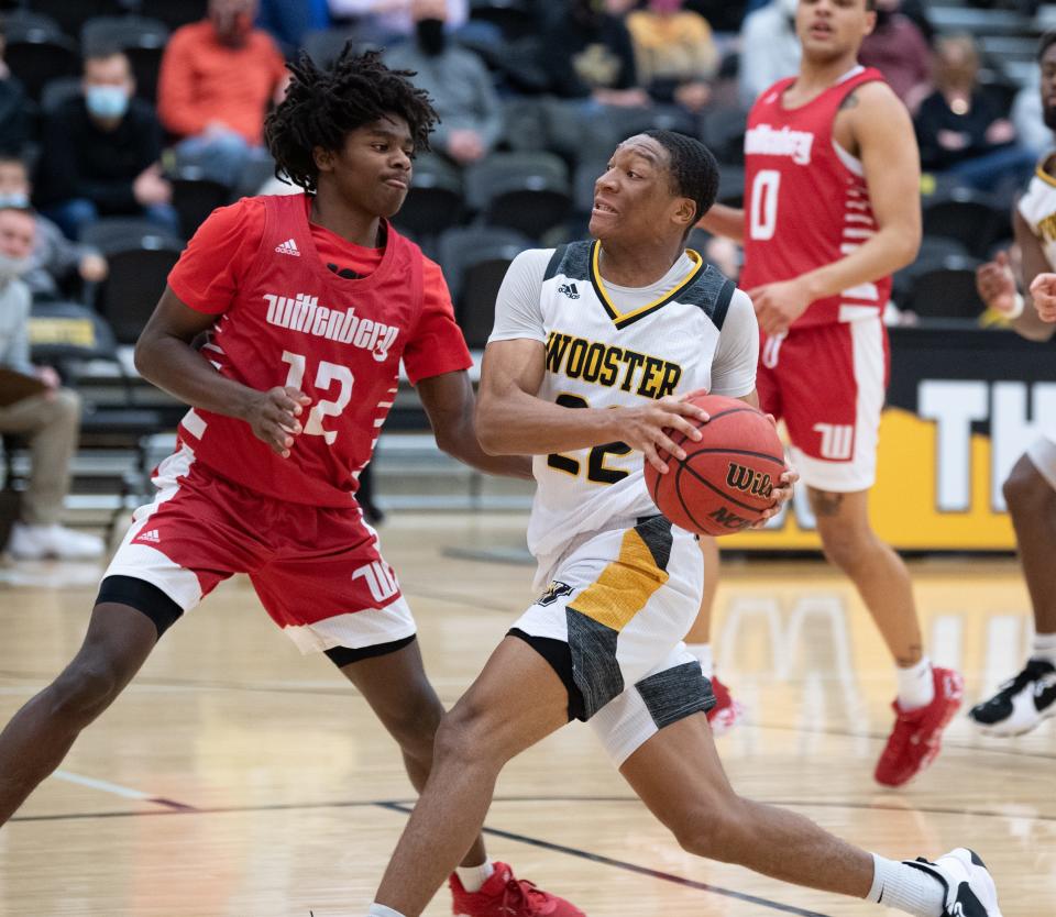 Jamir Billings drives the lane against Wittenberg. Billings had 15 points and 10 assists, becoming the first Scot with three straight 10-assist games.