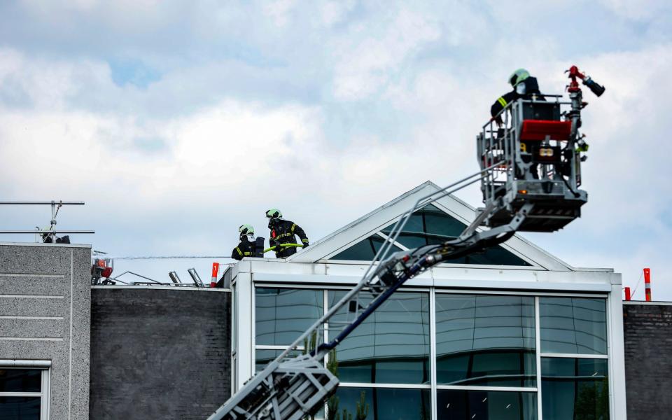 Police and fire departments work at a building at Novo Nordisk in Bagvaerd today