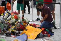 <p>People pay their respects at a memorial before the hearse carrying Miami Marlins pitcher Jose Fernandez passes in front of the Marlins baseball stadium on September 28, 2016 in Miami, Florida. Mr. Fernandez was killed in a weekend boat crash in Miami Beach along with two friends. (Photo by Joe Raedle/Getty Images) </p>