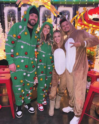 <p>Brittany Mahomes/Instagram</p> The Bells and Mahomes wear holiday-inspired onesies.