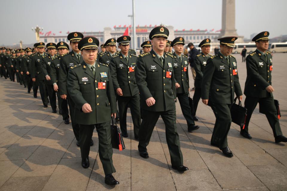 <p>Military delegates arrive for the second plenary session of the first session of the 13th National People’s Congress (NPC) at the Great Hall of the People in Beijing on March 9, 2018. (Photo: Wu Hong/EPA-EFE/REX/Shutterstock) </p>