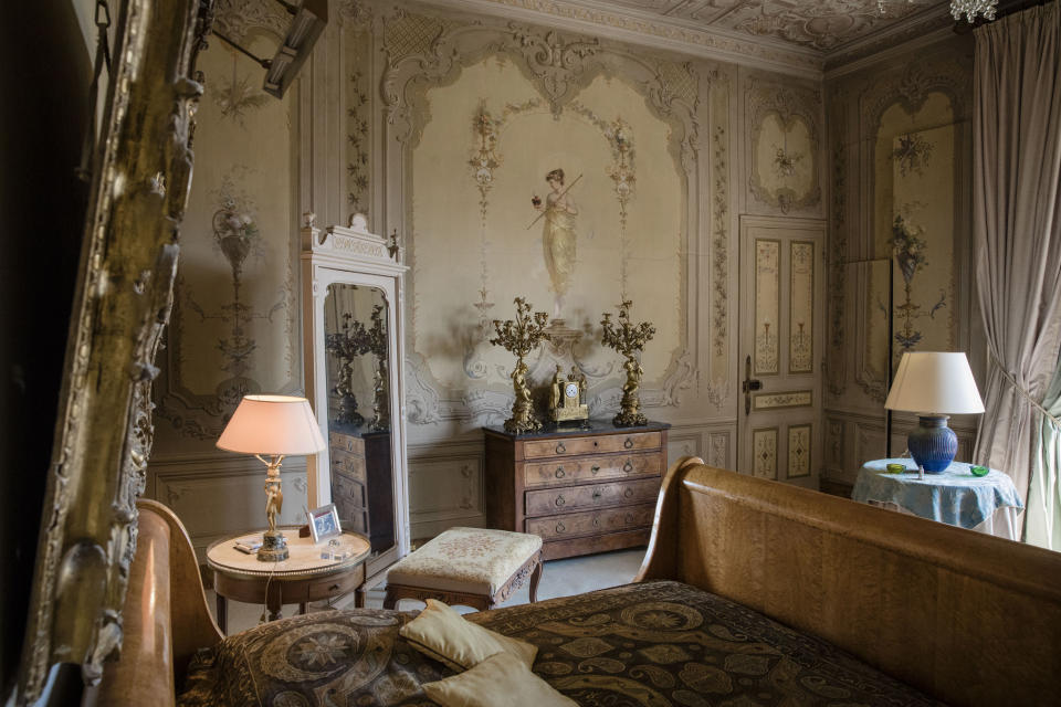 <p>Antique furnishings decorate one of the 14 bedrooms in the near-200-year-old building. </p>