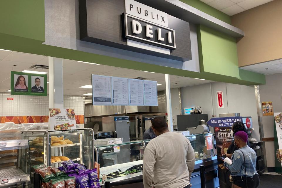 Clients wait to order lunch at the Publix Supermarket Deli in Miami Shores, Fla., Tuesday April 27, 2021.