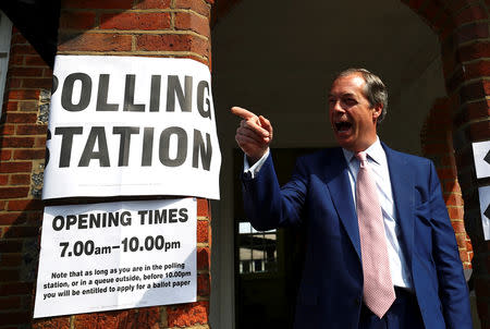 Brexit Party leader Nigel Farage gestures as he leaves a polling station after voting in the European elections, in Biggin Hill, Britain, May 23, 2019. REUTERS/Hannah McKay