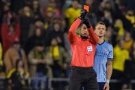 Oct 31, 2017; Columbus, OH, USA; Center referee Ismail Elfath goes to the VAR and issues a red card to New York City FC defender Alexander Callens (6) for a foul on Columbus Crew SC forward Justin Meram (not pictured) in the second half at MAPFRE Stadium. Mandatory Credit: Trevor Ruszkowski-USA TODAY Sports