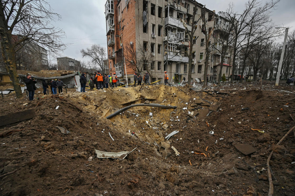 A crater outside a damaged residential building in Kharkiv, Ukraine, Tuesday, Jan. 2, 2024.  (Sergey Bobok / AFP - Getty Images)