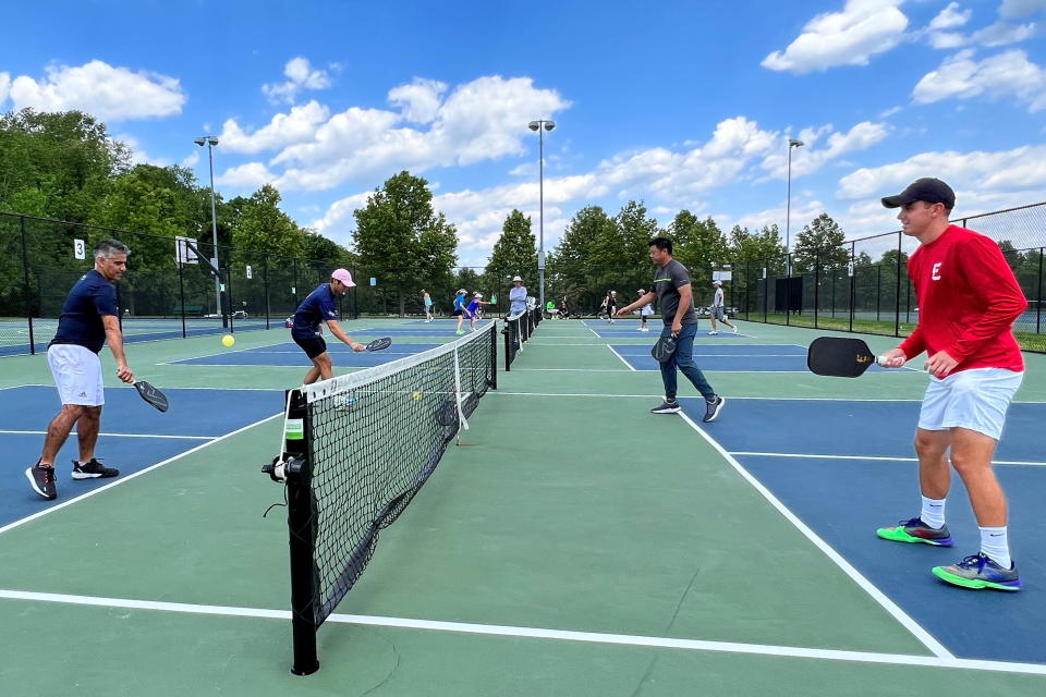 Profession pickleball player Ben Johns plays with his older brother Collin Johns in Bethesda, Maryland, U.S. May 17, 2022. REUTERS/Kevin Fogarty