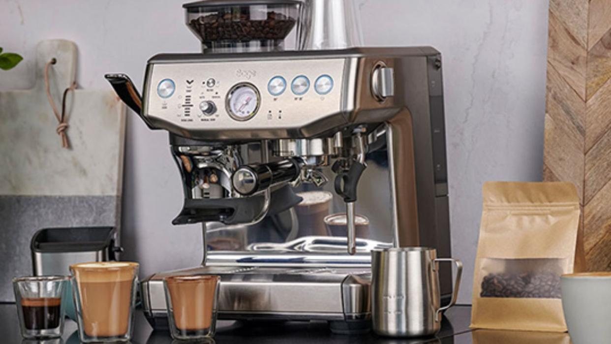  Breville Barista Express with latte, cappuccino, and espresso on a countertop 