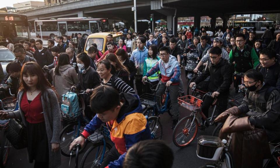 A check on runaway growth … Beijing’s commuters during rush hour.