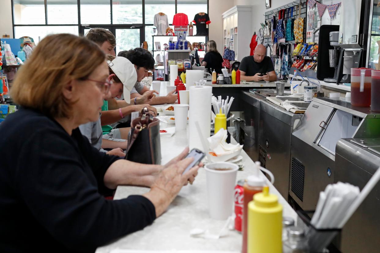 A packed lunch counter at the ADD Drug classic soda fountain in Athens, Ga., on Thursday, July 21, 2023. The soda fountain has been a favorite for more than 60 years.