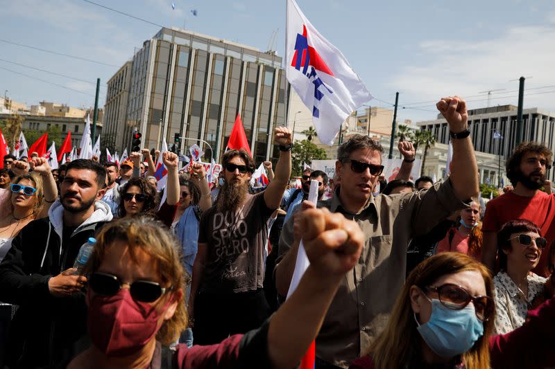 Greek Communist Party supporters take part in a rally commemorating May Day in Athens