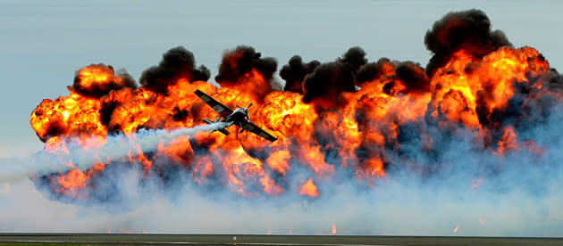 Roaring past in front of a wall of fire, the Tinstix of Dynamite team perform at the Melbourne International Airshow. The team mix dramatic flying techniques with fire displays to put on a stunning show (Alex Coppel / Newspix / Rex Features)