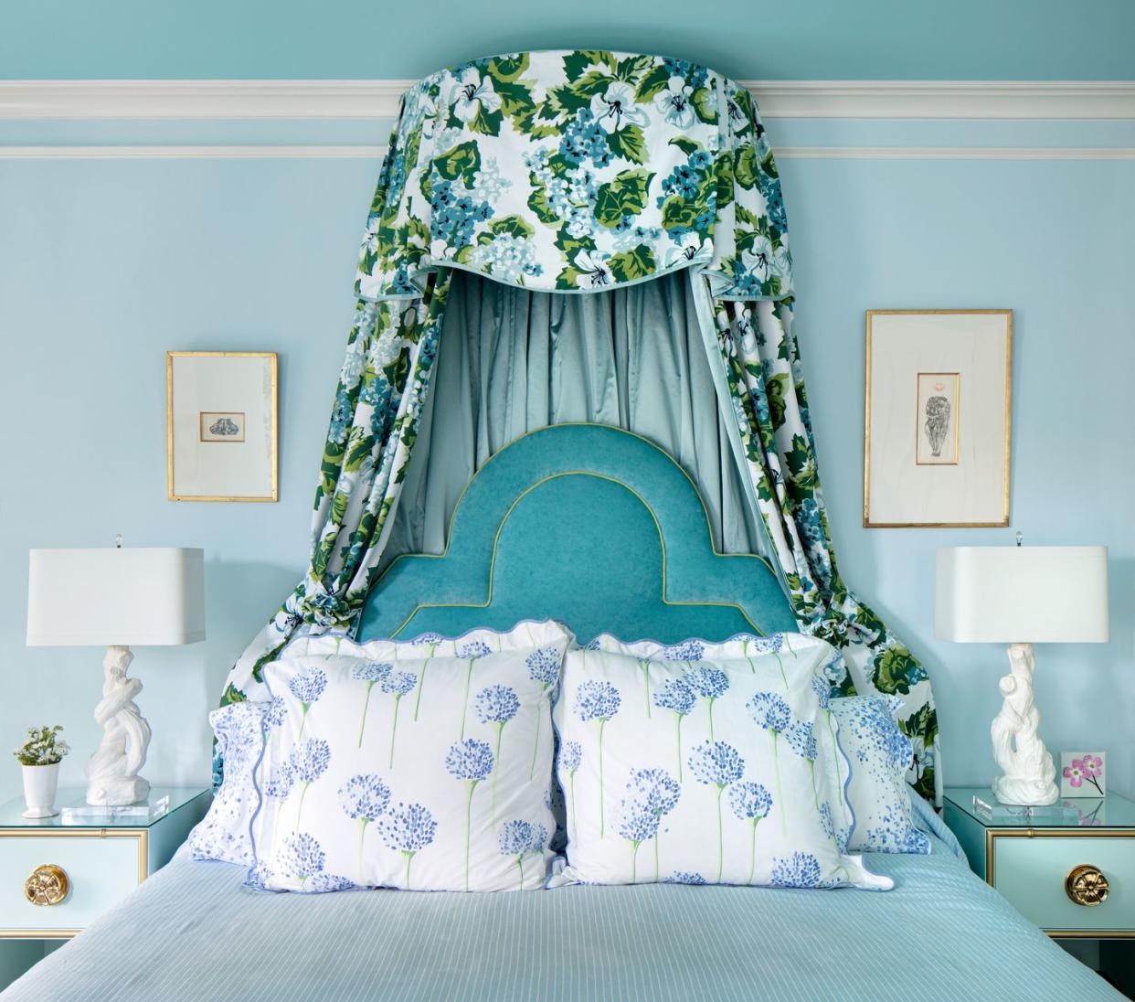 a bed with a flowered headboard