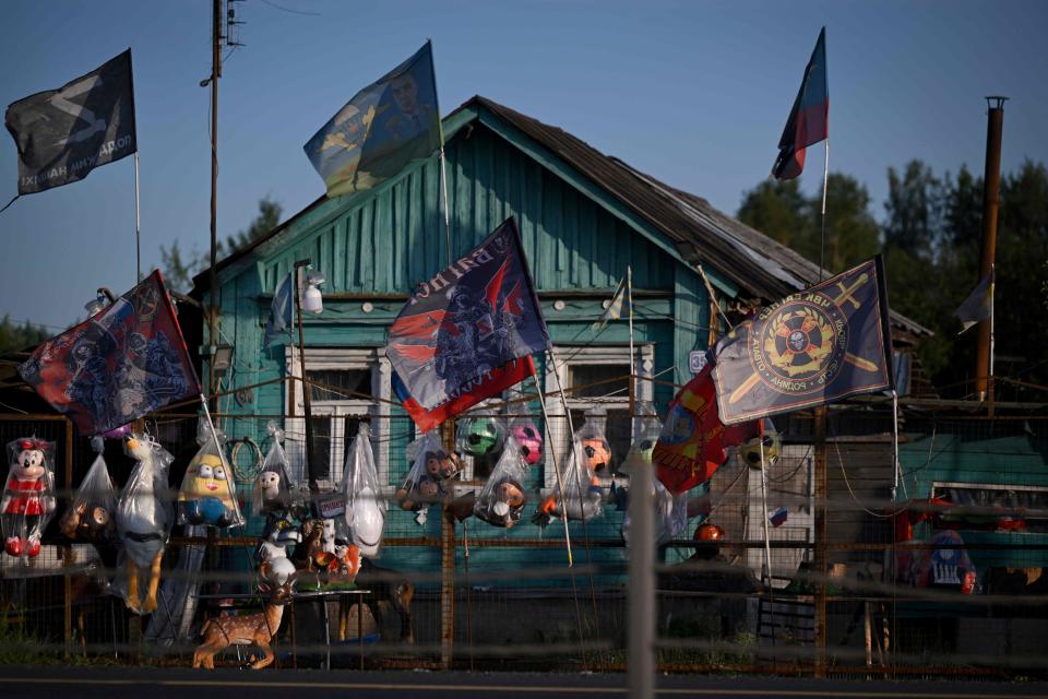 Flags, including those of the Wagner private mercenary group, for sale on a road outside Moscow (AFP via Getty Images)