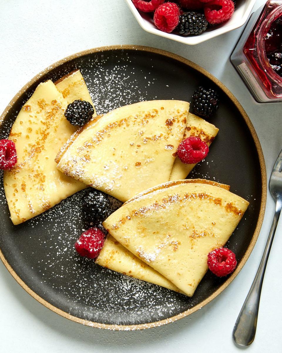 crepes with raspberries, blackberries, and dusted with powdered sugar