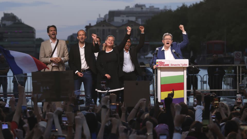 Jean-Luc Mélenchon (right), leader of the far-left France Unbowed party, celebrates the second-round results at a rally in Paris, July 7, 2024. - Thomas Padilla/AP