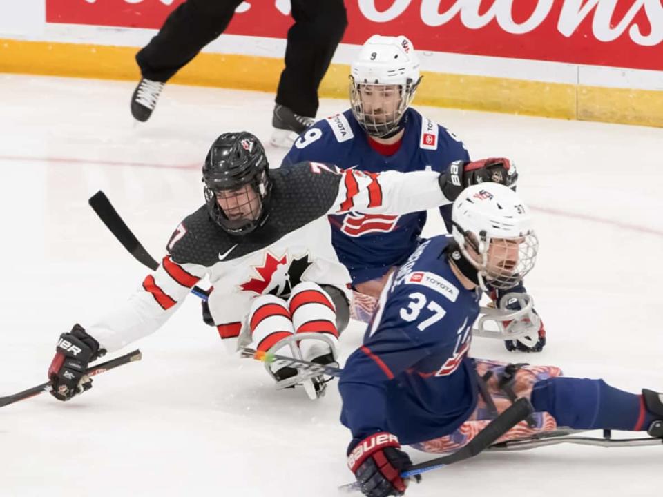 Canadian defenceman Zach Lavin plays the puck during a 5-1 loss to the United States on Saturday in the gold-medal game at the 2022 Para Hockey Cup in Bridgewater, N.S. (@HockeyCanada/Twitter - image credit)