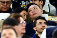 David Han Li sits in the tribune during the Juventus vs Barcelona UEFA Champions League soccer match in Turin, Italy April 11, 2017. Picture taken on April 11, 2017. REUTERS/Alessandro Bianchi