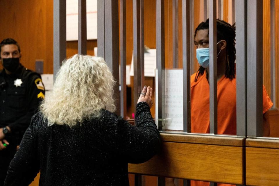 Mass shooting suspect Dandrae Martin, 26, talks with defense attorney Linda Parisi during his appearance in Superior Court in Sacramento on April 5.