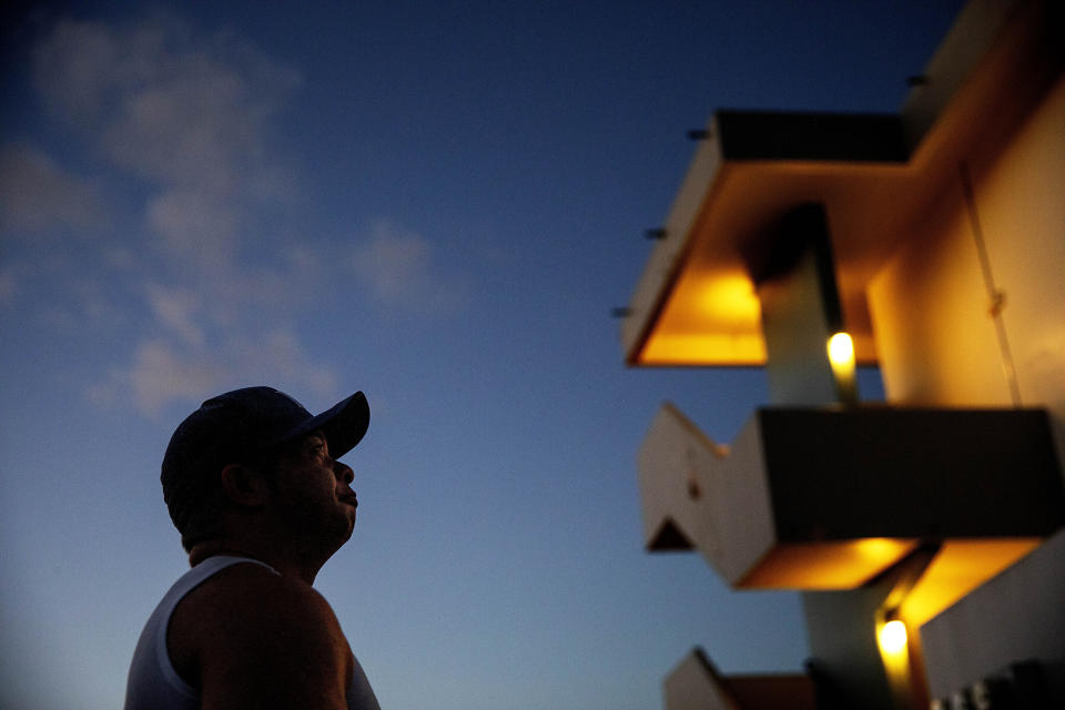 Troy Torres, 38, stands outside the apartment where he says in a lawsuit he was sexually molested at age 13 by Ray Caluag, the music and religion teacher at Saint Anthony Catholic School where he attended, in Hagatna, Guam, Friday, May 10, 2019. "There are a lot of sick people on this island and there are so many institutions who cover it up," said Torres. "And these are kids, you know. I just don't understand how there can be so many people who claim to care about the future of this island, the kids, and yet they do nothing to protect kids." The AP was unable to reach Caluag for comment. Videos on the internet show Caluag conducting a Catholic youth orchestra in the Philippines. (AP Photo/David Goldman)