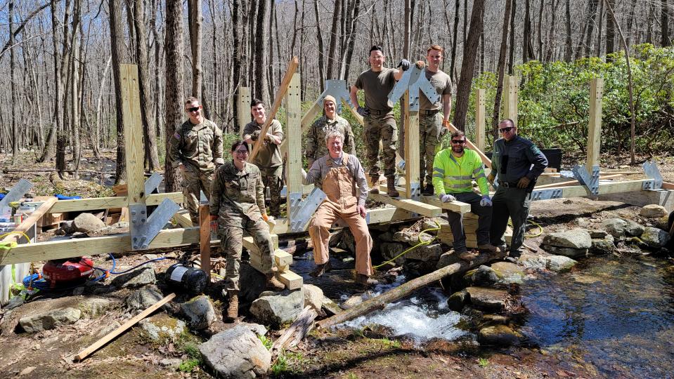 The 2022 trail-bridge-building crew designed and built a 30-foot-long and 7-foot-wide ’Thru-Truss’ bridge at Harriman State Park. (Ed Dunnigan, Park Engineer, Hudson Valley District - Palisades Region)