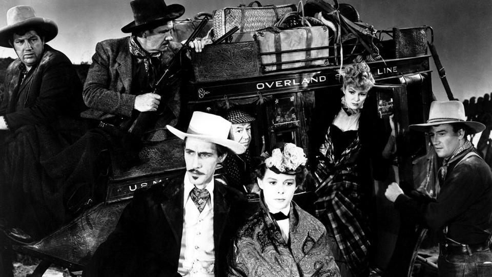 Andy Devine, George Bancroft, John Carradine, Donald Meek, Louise Platt, Claire Trevor, John Wayne in STAGECOACH.