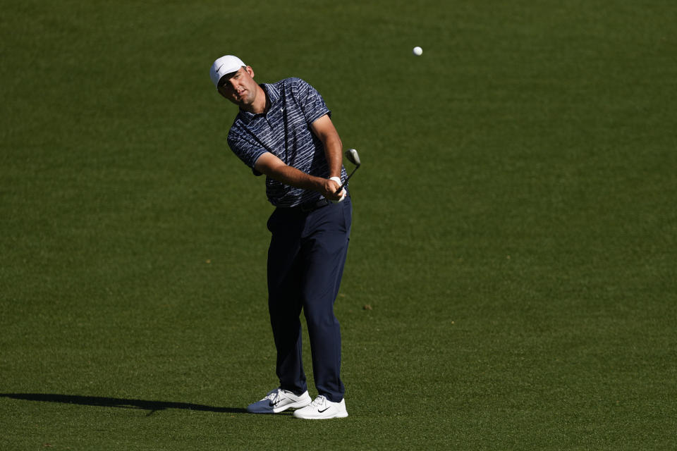 Scottie Scheffler chips to the eighth green during the final round at the Masters golf tournament on Sunday, April 10, 2022, in Augusta, Ga. (AP Photo/Robert F. Bukaty)