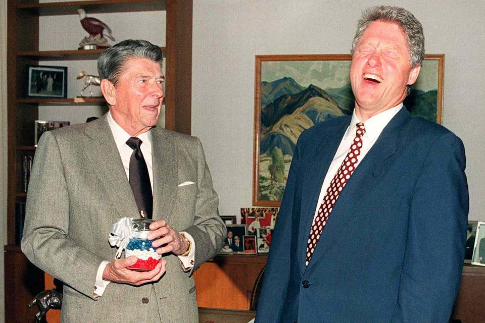 <p>Bill Clinton breaks into laughter as Ronald Reagan presents him with a jar of red, white and blue jelly beans that, Reagan said, kept him from going to back to cigarettes. The two met in Los Angeles on Nov. 27, 1992, to discuss Clinton's transition into the White House.</p>