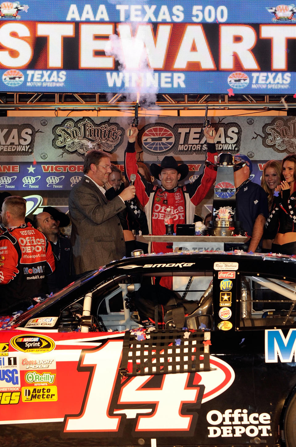 FORT WORTH, TX - NOVEMBER 06: Texas Motor Speedway president Eddie Gossage (L) poses with Tony Stewart, driver of the #14 Office Depot/Mobil 1 Chevrolet, in Victory Lane after winning the NASCAR Sprint Cup Series AAA Texas 500 at Texas Motor Speedway on November 6, 2011 in Fort Worth, Texas. (Photo by John Harrelson/Getty Images for NASCAR)