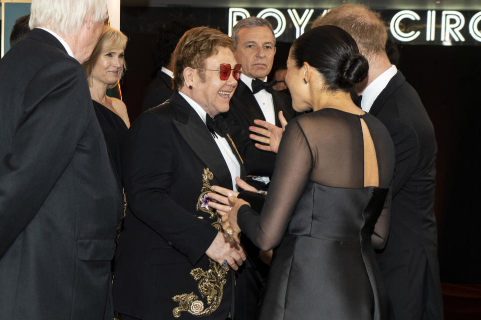 Harry and Meghan chat with Elton John as they arrive for the European premiere of "The Lion King" in London on July 14.&nbsp; (Photo: POOL New / Reuters)