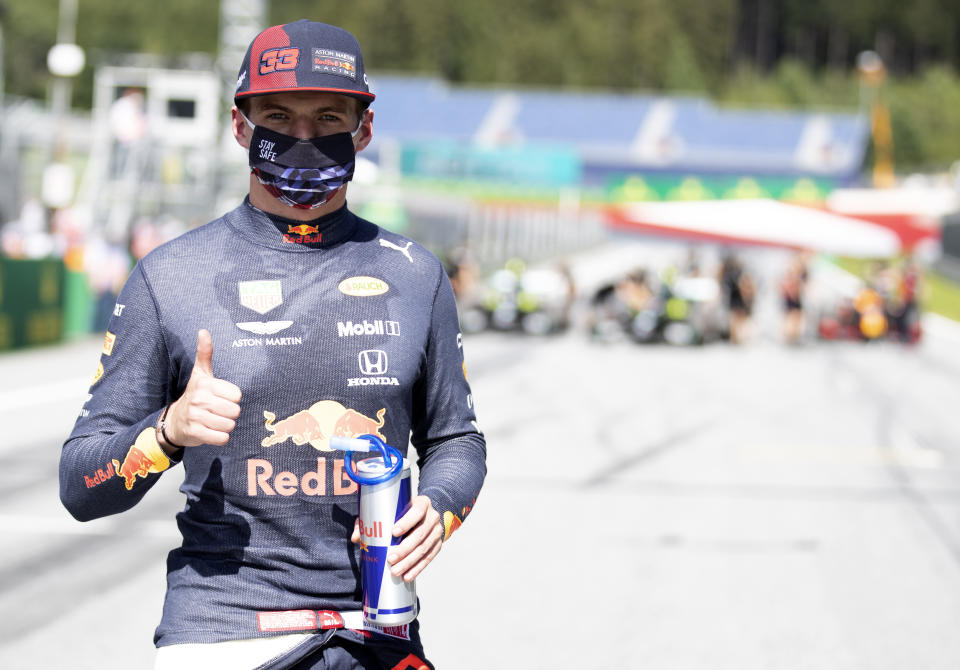 Red Bull driver Max Verstappen of the Netherlands, wearing a mask against the spread of the coronavirus, poses after he clocked the third fastest time during the qualifying session at the Red Bull Ring racetrack in Spielberg, Austria, Saturday, July 4, 2020. The Austrian Formula One Grand Prix will be held on Sunday. (Mark Thompson/Pool via AP)