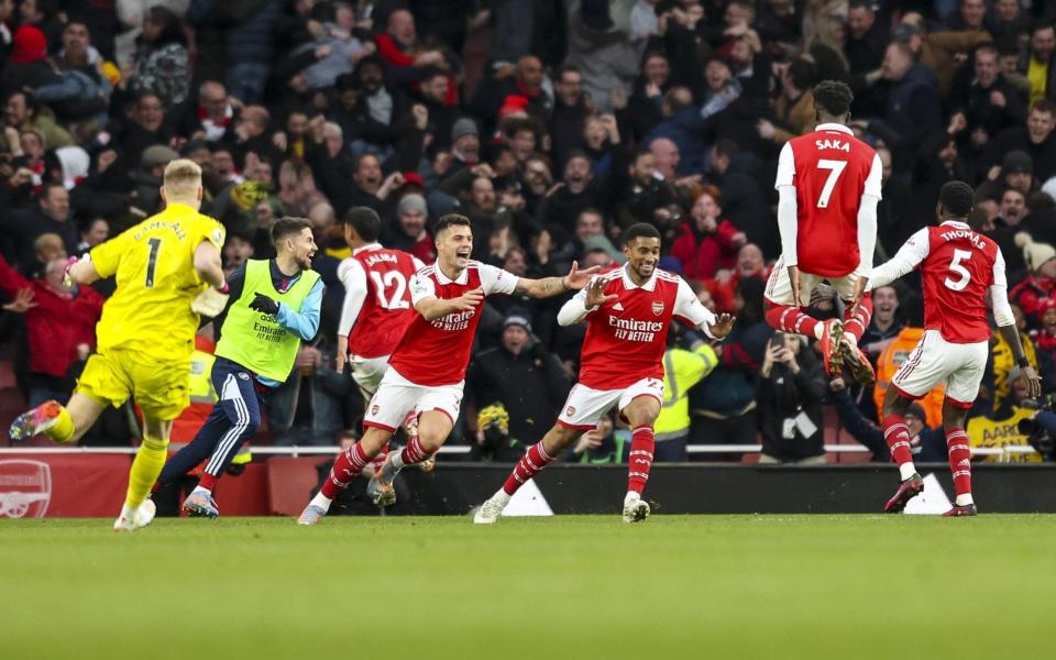 Arsenal celebrate another last-gasp winner after Reiss Nelson's 97th-minute strike against Bournemouth - Getty Images/Robin Jones