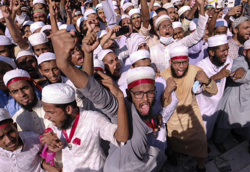 Supporters of Islamist parties shout slogans during a protest after Friday prayers in Dhaka, Bangladesh, Friday, Oct. 30, 2020. Thousands of Muslims and activists marched through streets and rallied across Bangladesh’s capital on Friday against the French president’s support of secular laws that deem caricatures of the Prophet Muhammad as protected under freedom of speech. (AP Photo/Mahmud Hossain Opu)