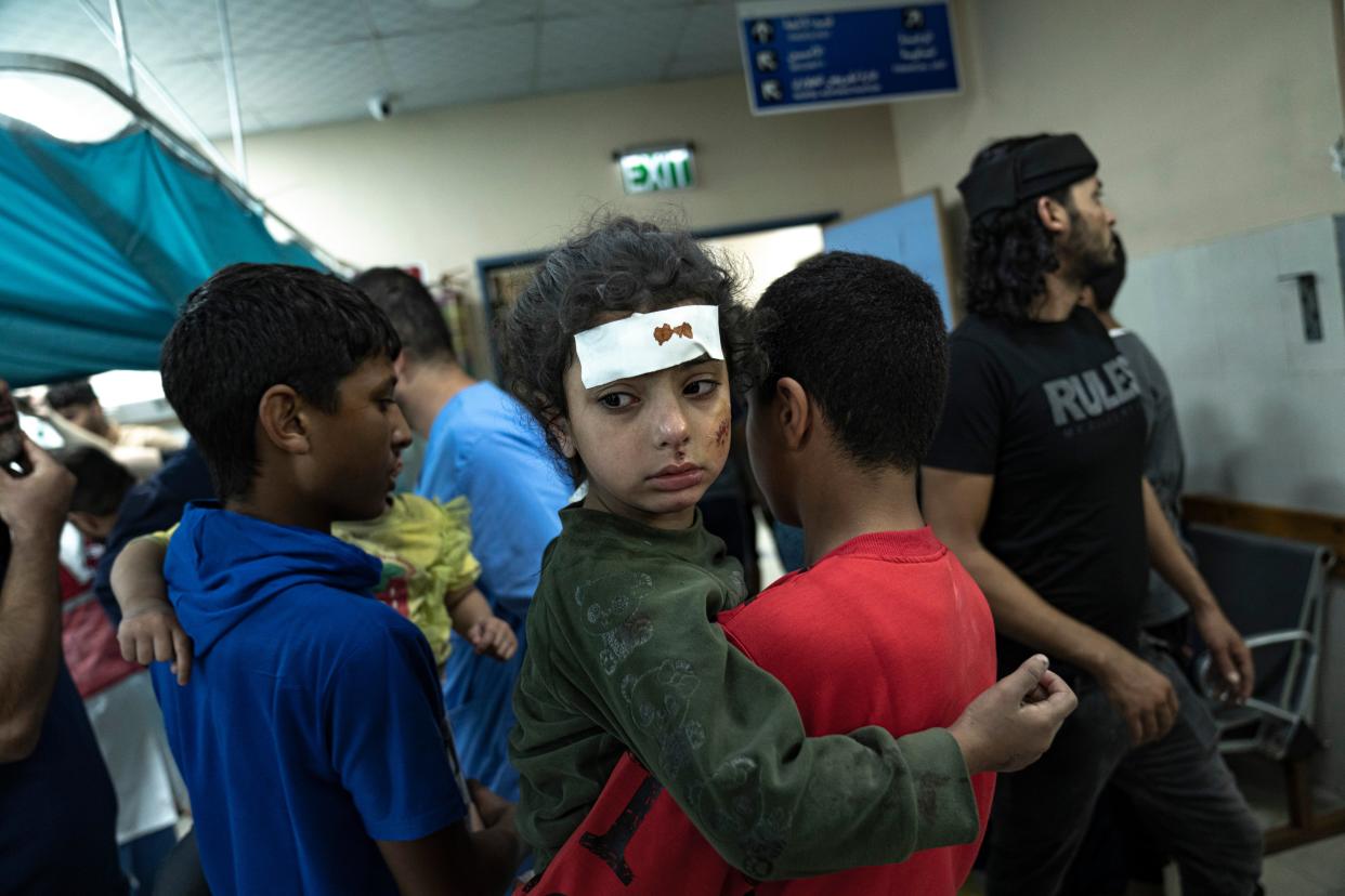 Those wounded in Israeli bombardment of the Gaza Strip arrive at a hospital in Khan Younis (AP)