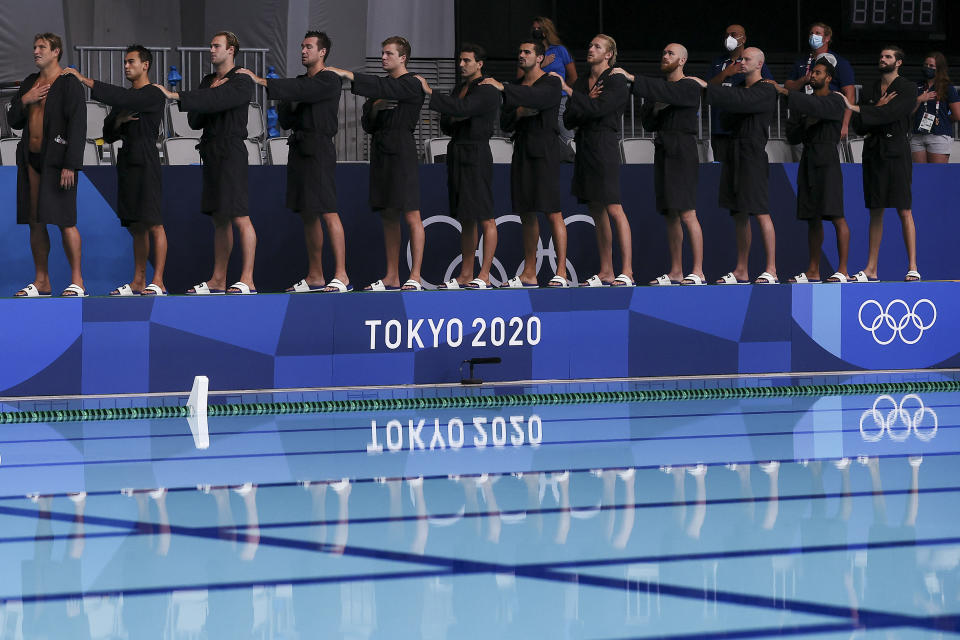 <p>Team United States players line up for the national anthems during the Men’s Classification 5th-6th match between Croatia and the United States on day sixteen of the Tokyo 2020 Olympic Games at Tatsumi Water Polo Centre on August 08, 2021 in Tokyo, Japan. (Photo by Tom Pennington/Getty Images)</p> 