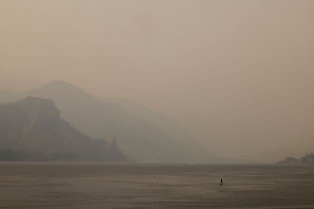 A lone paddleboarder on the Columbia River in Oregon during an abnormal heat wave in the Pacific Northwest on Aug. 13. (Photo: MICHAEL HANSON via Getty Images)