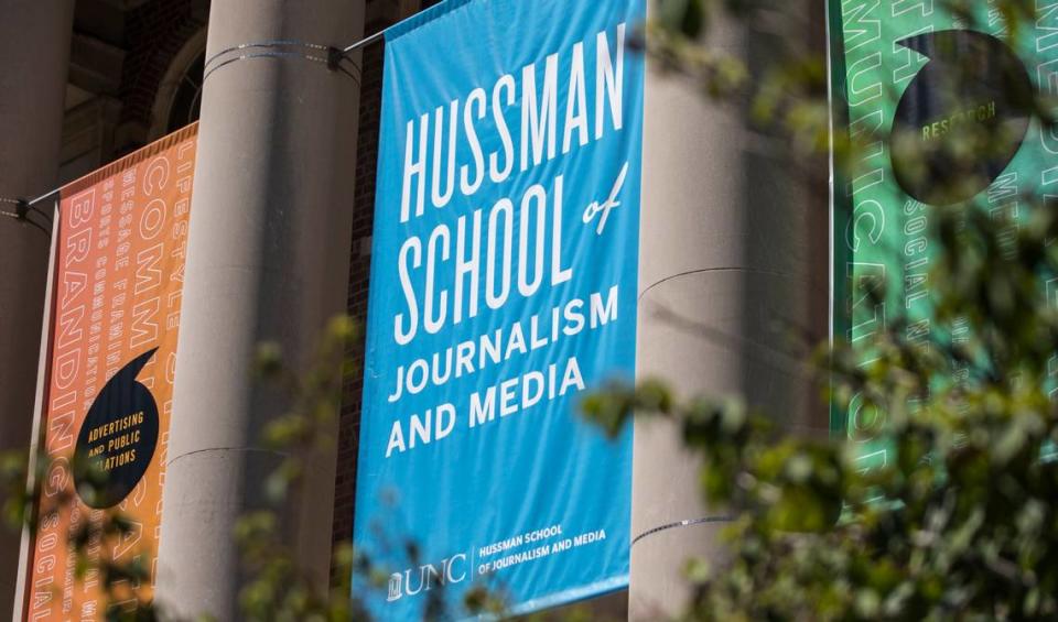 A banner identifying the Hussman School of Journalism and Media at UNC-Chapel Hill hangs above the steps of Carroll Hall in Chapel Hill, N.C., pictured here on Wednesday, July 14, 2021.