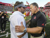 Virginia Tech head coach Brett Pry, left, shakes hands with Rutgers head coach Greg Schiano after an NCAA college football game against Rutgers, Saturday, Sept. 16, 2023, in Piscataway, N.J. (Andrew Mills/NJ Advance Media via AP)