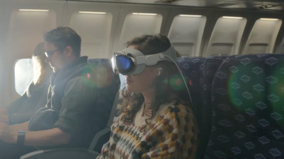 Apple's Vision Pro being used by a woman on an airplane.