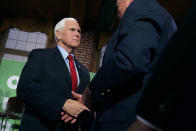 Former Vice President Mike Pence shakes hands with guests during a gathering, Wednesday, Dec. 8, 2021, in Manchester, N.H. (AP Photo/Charles Krupa)