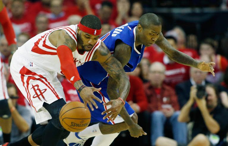 Houston Rockets' Josh Smith battles for a loose basketball with Los Angeles Clippers' Jamal Crawford during their game on May 4, 2015 at the Toyota Center