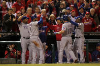 ST LOUIS, MO - OCTOBER 20: Michael Young #10 of the Texas Rangers celebrates in the dugout after hitting an RBI sacrifice fly ball to take a 2-1 lead in the ninth inning during Game Two of the MLB World Series against the St. Louis Cardinals at Busch Stadium on October 20, 2011 in St Louis, Missouri. The Rangers won 2-1. (Photo by Ezra Shaw/Getty Images)