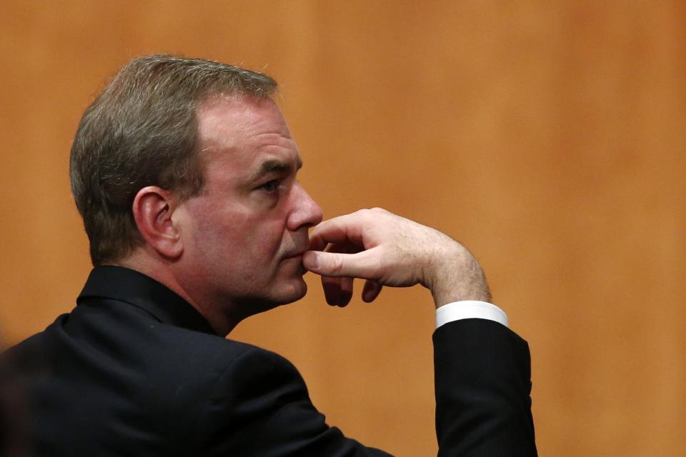 Boeing Commercial Airplanes Vice President and Chief Project Engineer Mike Sinnett listens during a hearing at the National Transportation Safety Board (NTSB) in Washington, Tuesday, April 23, 2013, investigating a battery fire aboard a Boeing 787. As airlines prepare to resume flying Boeing's beleaguered 787 Dreamliners, federal investigators looked Tuesday at how regulators and the company tested and approved the plane's cutting-edge battery system, and whether the government cedes too much safety-testing authority to aircraft makers. (AP Photo/Charles Dharapak)