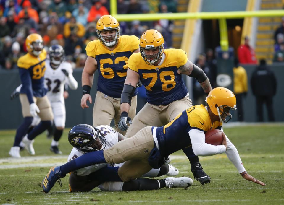 Green Bay Packers quarterback Brett Hundley is sacked by Baltimore Ravens' Terrell Suggs during a 23-0 Ravens win. (AP)