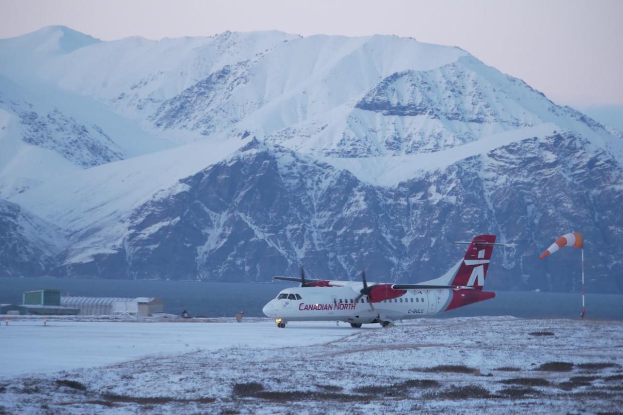 A Canadian North ATR 42-320 aircraft taxis at the local airport in Pond Inlet, Nunavut, in October 2022. (David Gunn/CBC News - image credit)