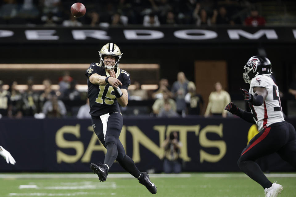 New Orleans Saints quarterback Trevor Siemian (15) throws the ball against the Atlanta Falcons during the first half of an NFL football game, Sunday, Nov. 7, 2021, in New Orleans. (AP Photo/Derick Hingle)