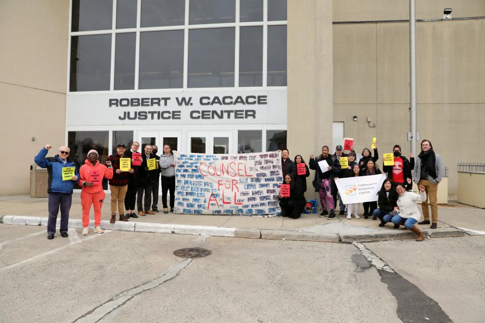 Housing advocates pose for a group photo after rallying for the right-to-counsel legislation outside Yonkers City Court March 24, 2023. The right-to-counsel would give tenants in eviction proceedings access to legal representation in their cases.